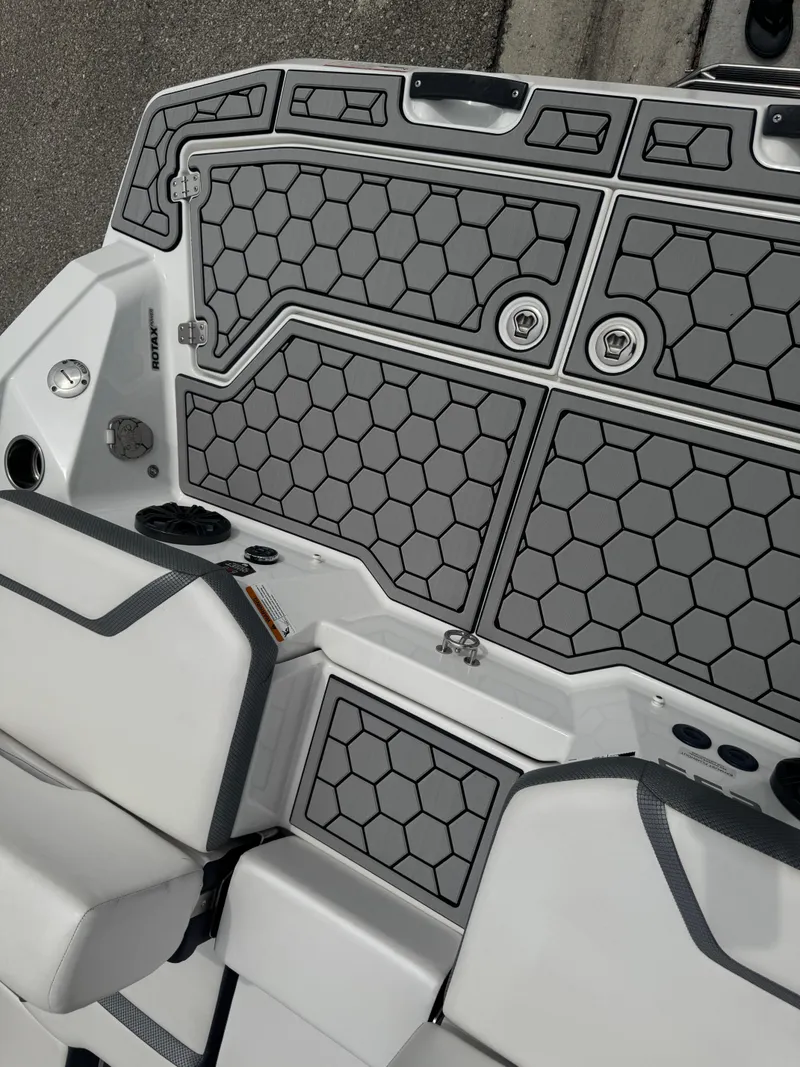 Slide: The Image of 2020 Scarab 255 Open ID boat interior with hexagonal pattern flooring and seating. - 36