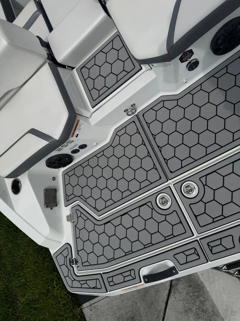 Slide: The Image of 2020 Scarab 255 Open ID boat interior with hexagonal pattern flooring. - 37