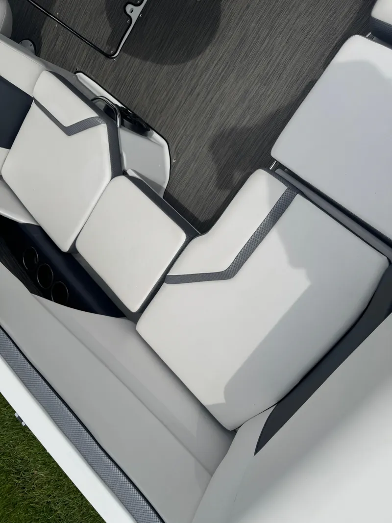 Slide: The Image of 2020 Scarab 255 Open ID boat interior with white cushioned seating. - 39