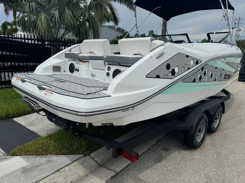 Slide: The Image of 2020 Scarab 255 Open ID boat on trailer, featuring sleek design and modern graphics. - 4