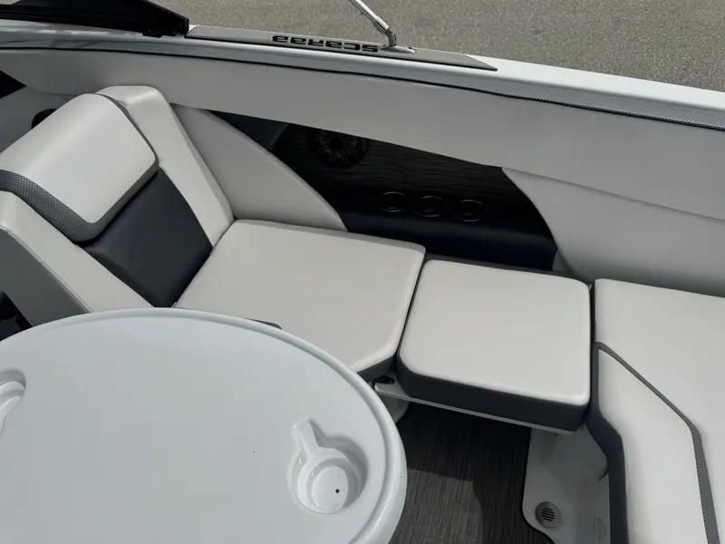 Slide: The Image of Interior of 2020 Scarab 255 Open ID boat with white seating and table. - 40