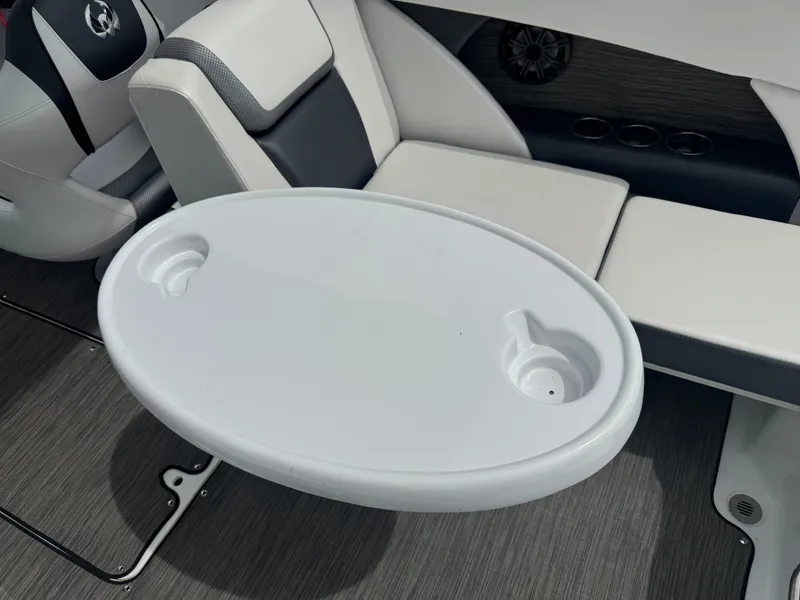 Slide: The Image of 2020 Scarab 255 Open ID boat interior with white table and seating. - 41