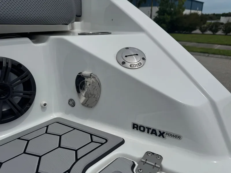 Slide: The Image of 2020 Scarab 255 Open ID boat interior, featuring Rotax power and water access panel. - 7