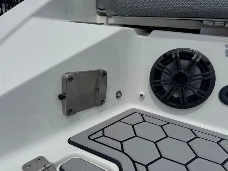 Slide: The Image of 2020 Scarab 255 Open ID boat interior with speaker and hexagonal floor design. - 9