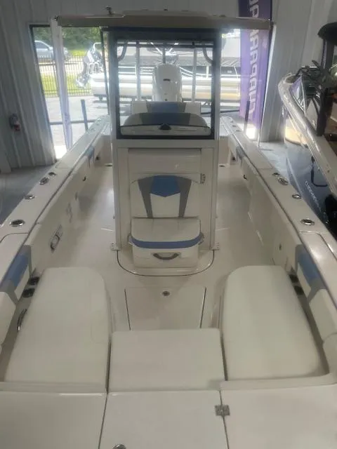 Slide: The Image of 2023 Robalo 266 Cayman boat interior with seating and helm station. - 11