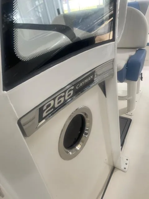 Slide: The Image of 2023 Robalo 266 Cayman boat interior with logo and seating detail. - 13