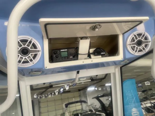 Slide: The Image of 2023 Robalo 266 Cayman boat dashboard with speakers and electronic equipment. - 17