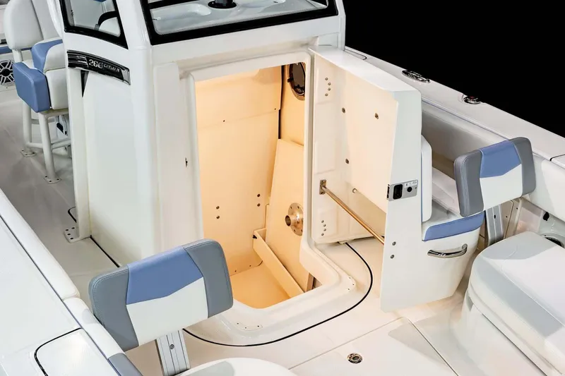 Slide: The Image of Manufacturer Provided Image: 2023 Robalo 266 Cayman boat interior with open storage compartment. - 33
