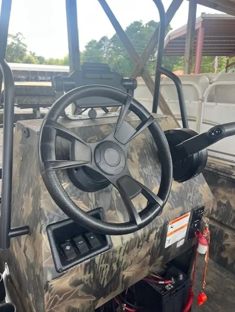 Slide: The Image of 2023 Lowe Roughneck 1860 CC boat steering console with camouflage design. - 5