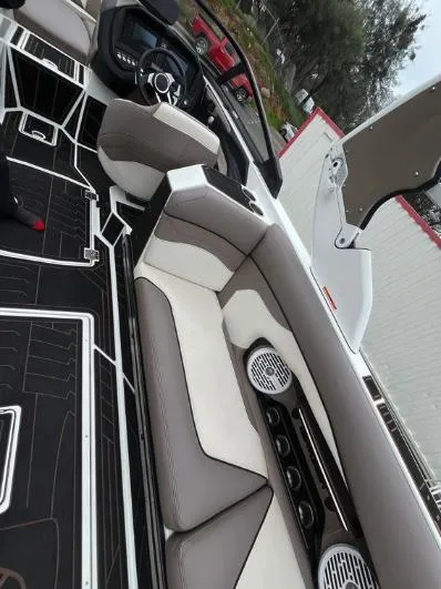 Slide: The Image of 2019 Centurion RI 257 boat interior with luxurious seating and modern dashboard design. - 15