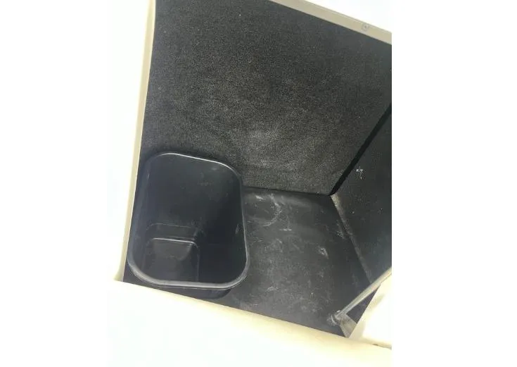 Slide: The Image of Storage compartment in 2019 Centurion RI 257 boat with black interior and container. - 17