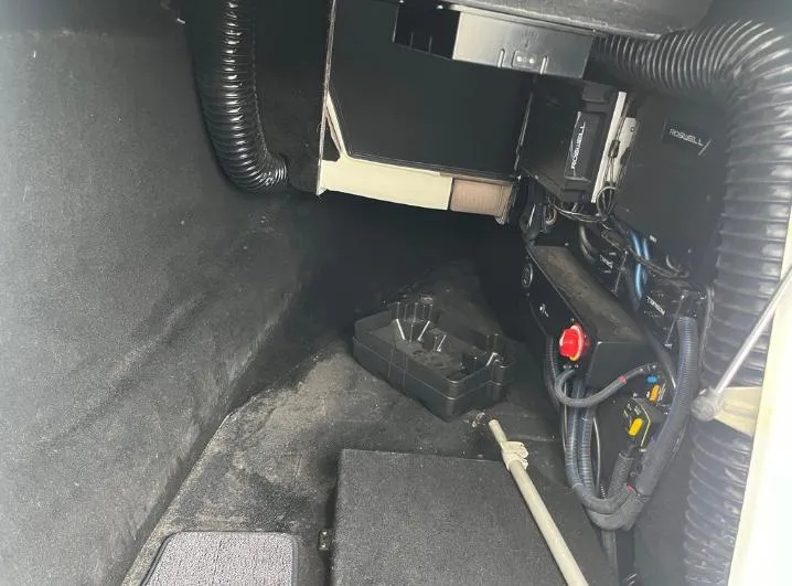 Slide: The Image of Interior view of a 2019 Centurion RI 257 boat's storage compartment with wiring and components. - 19