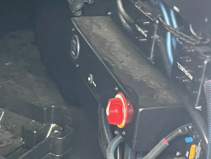 Slide: The Image of Control panel of a 2019 Centurion RI 257 boat with wiring and red emergency stop button. - 21