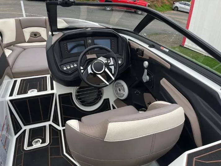 Slide: The Image of 2019 Centurion RI 257 boat interior with modern dashboard and steering wheel. - 23