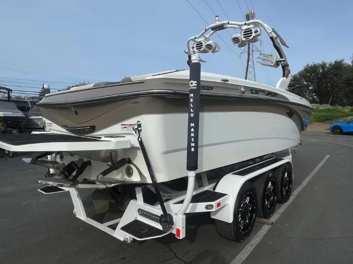 Slide: The Image of 2019 Centurion RI 257 boat on trailer, rear view, parked outdoors. - 30