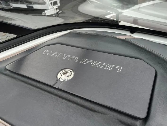 Slide: The Image of 2019 Centurion RI 257 boat dashboard with logo and keyhole detail. - 33