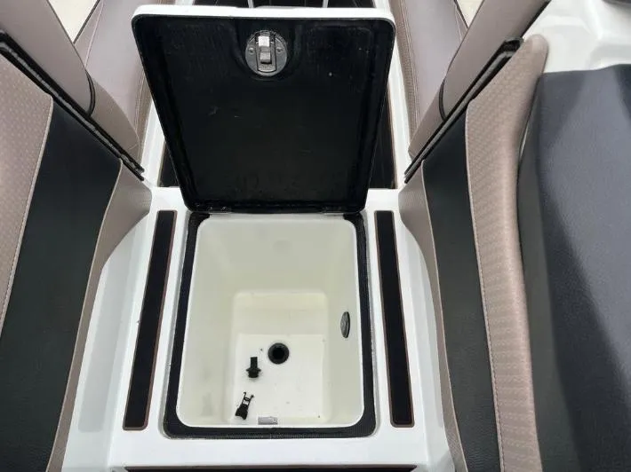 Slide: The Image of Open storage compartment in 2019 Centurion RI 257 boat, featuring sleek interior design. - 36