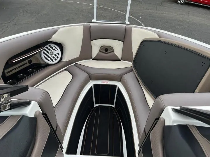 Slide: The Image of 2019 Centurion RI 257 boat interior with cushioned seating and speaker system. - 37