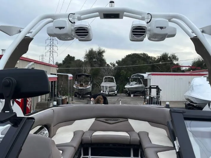 Slide: The Image of 2019 Centurion RI 257 boat interior with speakers, docked at a marina. - 39