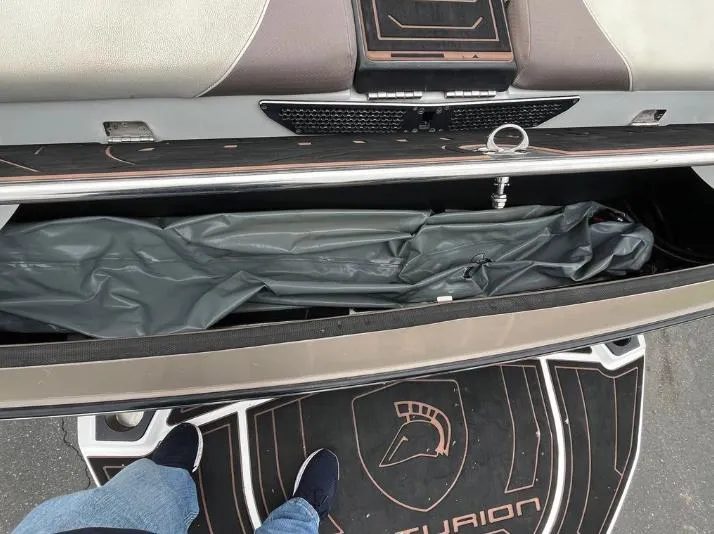 Slide: The Image of 2019 Centurion RI 257 boat storage compartment with cover, viewed from above. - 6