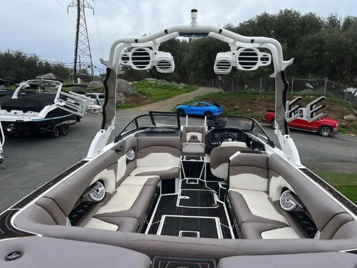 Slide: The Image of 2019 Centurion RI 257 boat interior with spacious seating and advanced audio system. - 7