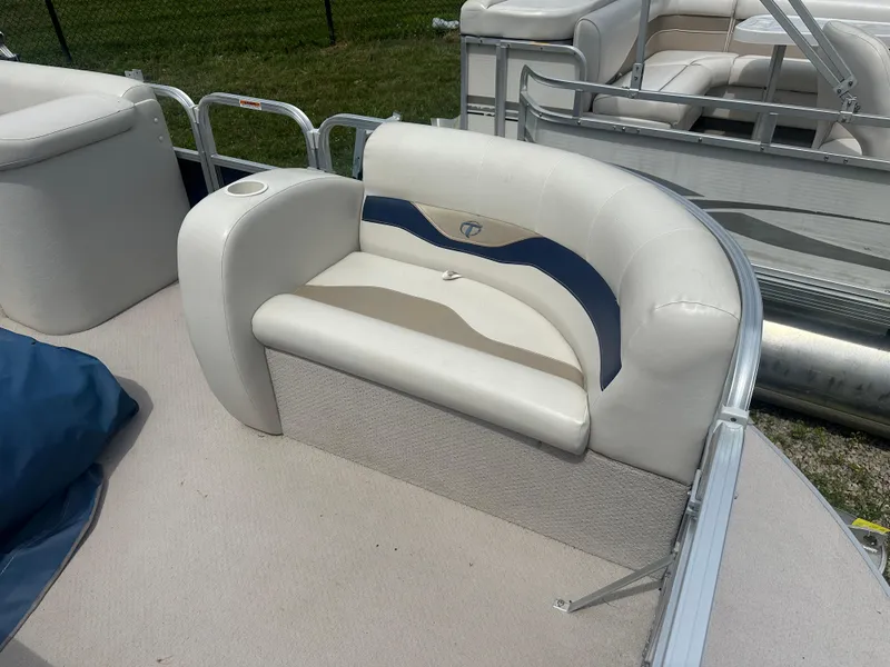 Slide: The Image of 2011 Tahoe LT1900 boat interior with white and blue seating. - 4