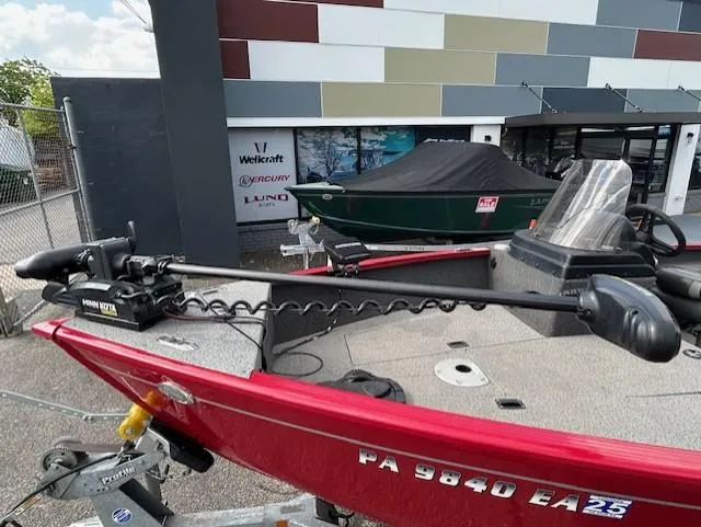 Slide: The Image of 2022 Lund 1775 Adventure SS boat with Minn Kota trolling motor, parked outside dealership. - 6