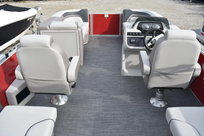 Slide: The Image of 2025 Godfrey Sweetwater 2086 SB pontoon boat interior with gray seating and red accents. - 2