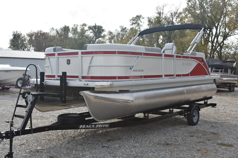 Slide: The Image of 2025 Godfrey Sweetwater 2086 SB pontoon boat on trailer, parked outdoors. - 4