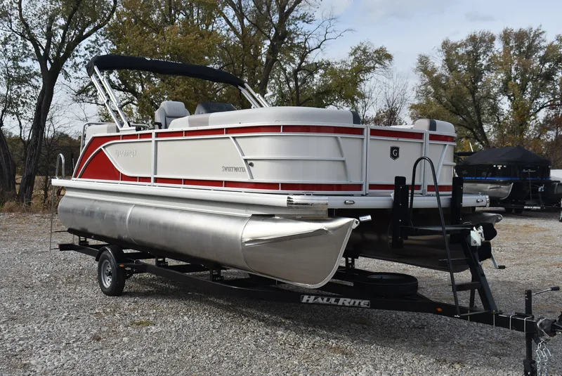 Slide: The Image of 2025 Godfrey Sweetwater 2086 SB pontoon boat on trailer, parked outdoors. - 5