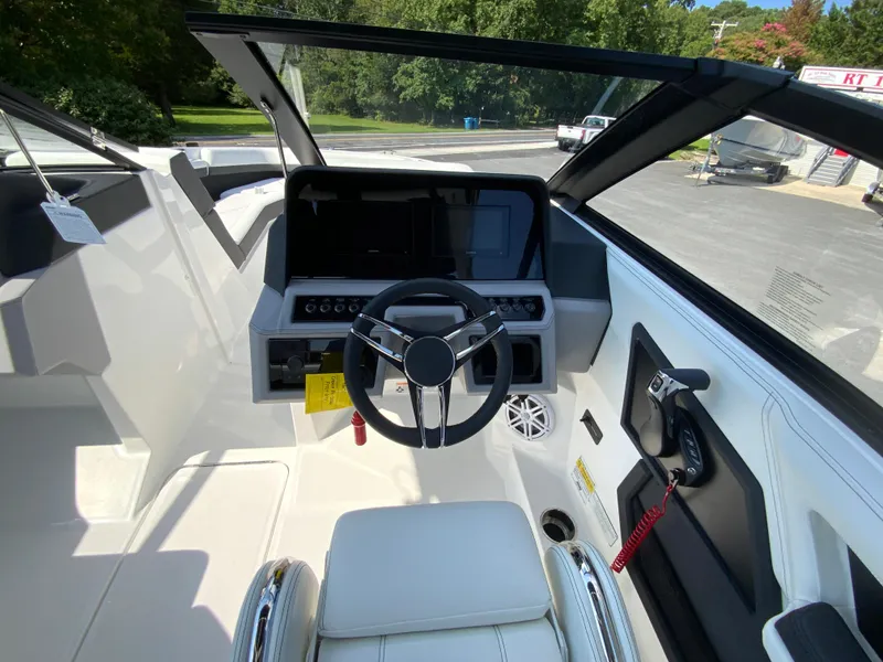 Slide: The Image of 2026 Cobalt R4 OB boat cockpit with modern steering and control panel. - 12