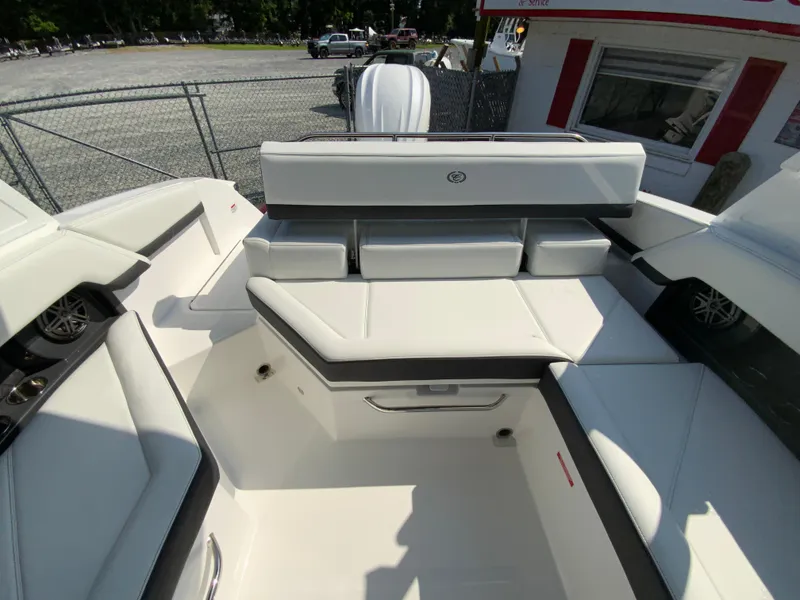 Slide: The Image of 2026 Cobalt R4 OB boat interior with white seating and modern design. - 16