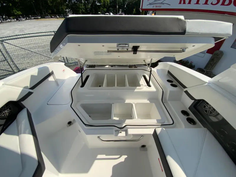 Slide: The Image of 2026 Cobalt R4 OB boat with open storage compartments and seating area. - 17