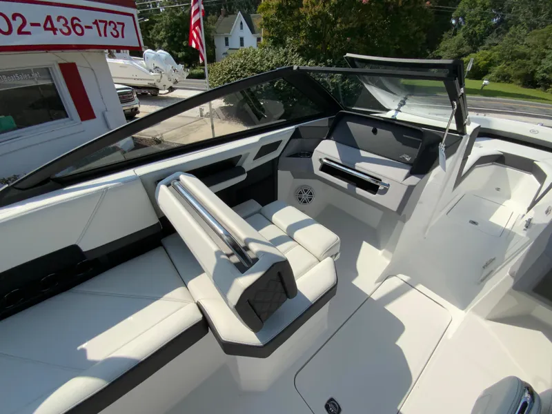 Slide: The Image of 2026 Cobalt R4 OB boat interior with sleek white seating and modern dashboard design. - 21