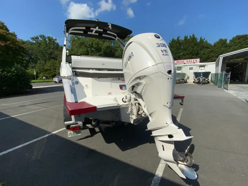 Slide: The Image of 2026 Cobalt R4 OB boat with Yamaha 300 V6 engine in a parking lot. - 8