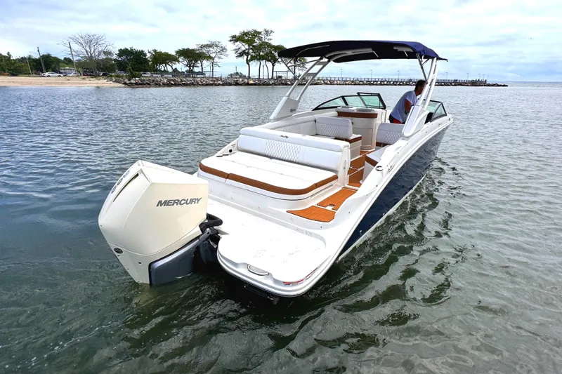 Slide: The Image of 2024 Sea Ray SDX 270 Outboard boat on water, featuring spacious seating and Mercury engine. - 12