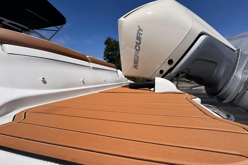Slide: The Image of 2024 Sea Ray SDX 270 Outboard with Mercury engine, featuring sleek deck design. - 13