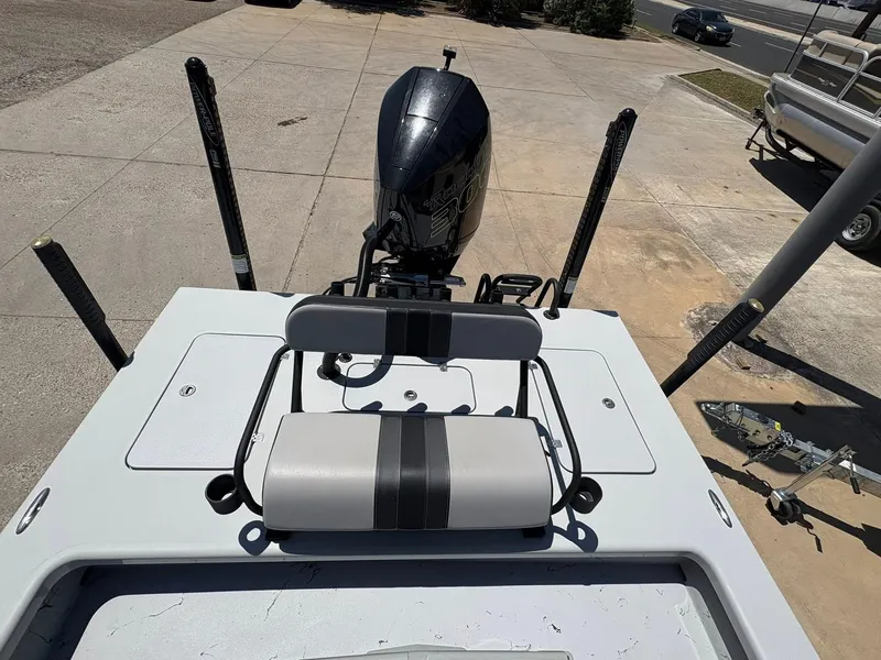 Slide: The Image of 2022 JH Performance Outlaw 250 boat with motor, viewed from above, parked on concrete. - 11