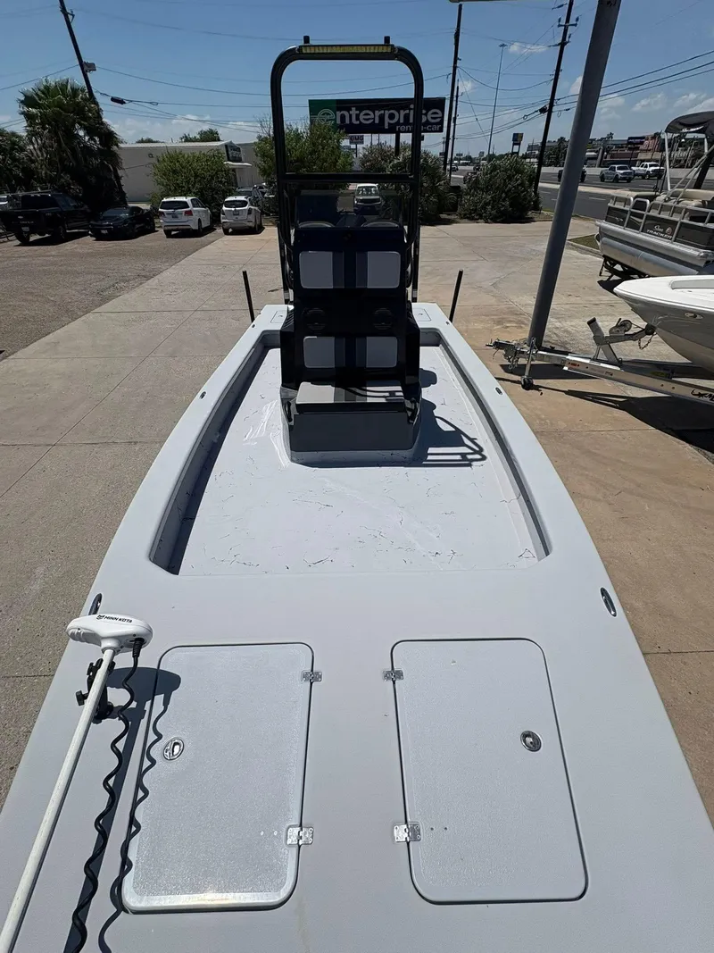 Slide: The Image of 2022 JH Performance Outlaw 250 boat on display at a dealership. - 15