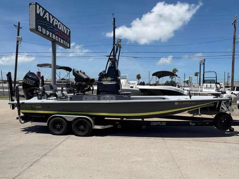 Slide: The Image of 2022 JH Performance Outlaw 250 boat at Waypoint Marine Supercenter, parked on a trailer. - 2