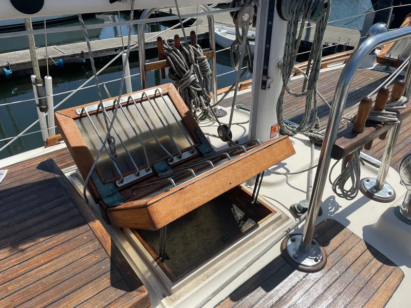 Slide: The Image of 1985 Hans Christian 33T sailboat deck with open hatch and rigging details. - 24