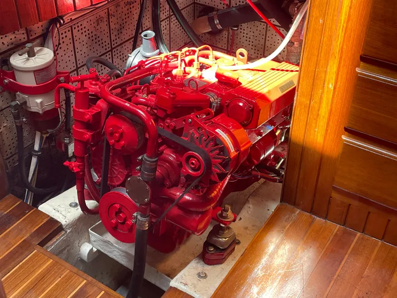 Slide: The Image of Red engine inside 1985 Hans Christian 33T sailboat, detailed view. - 25