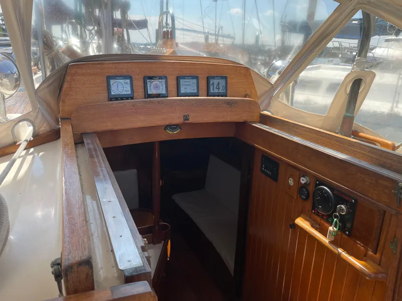 Slide: The Image of Interior view of 1985 Hans Christian 33T sailboat cockpit with navigation instruments. - 6
