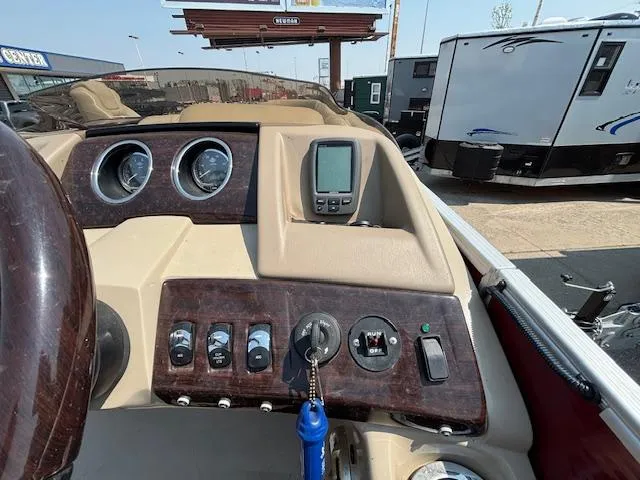 Slide: The Image of Dashboard of a 2012 Bennington R25 boat with gauges and controls. - 24