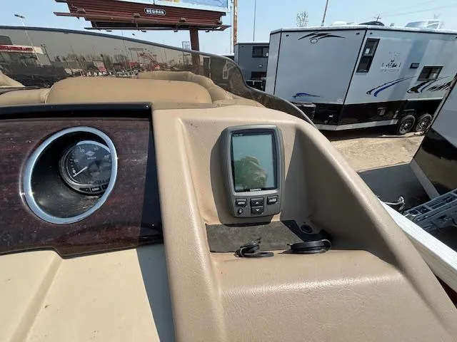 Slide: The Image of Dashboard of a 2012 Bennington R25 boat with navigation equipment. - 25