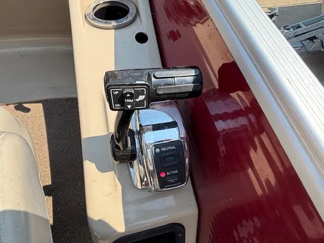 Slide: The Image of Boat throttle control on a 2012 Bennington R25, featuring trim and neutral settings. - 29