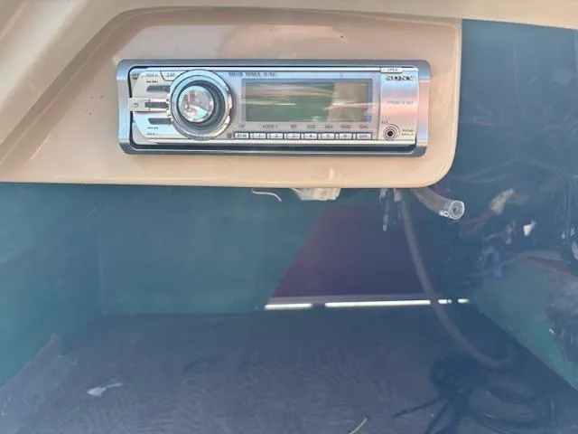 Slide: The Image of Boat dashboard with a Sony stereo system in a 2012 Bennington R25. - 34