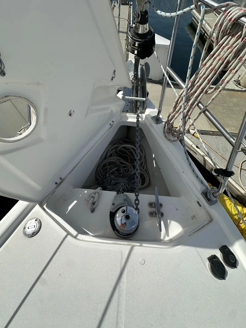 Slide: The Image of 2008 Hunter 38 sailboat deck with anchor chain and ropes. - 15