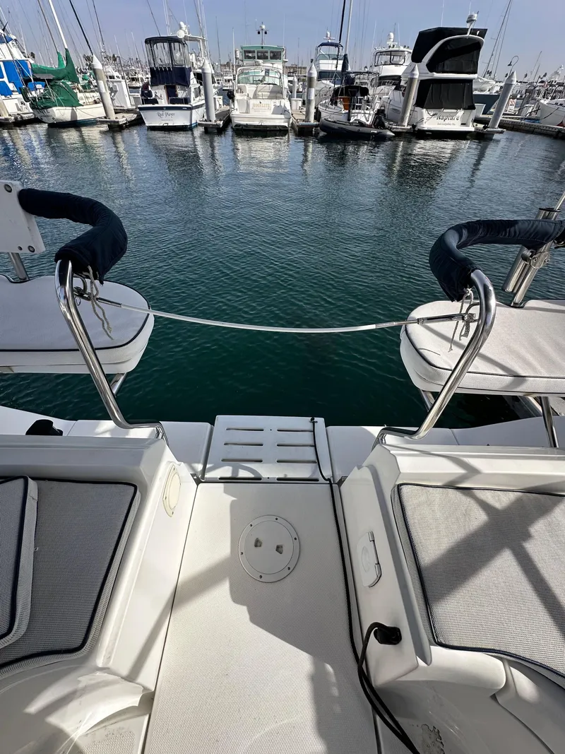 Slide: The Image of View from a 2008 Hunter 38 sailboat's deck overlooking a marina with multiple boats. - 21