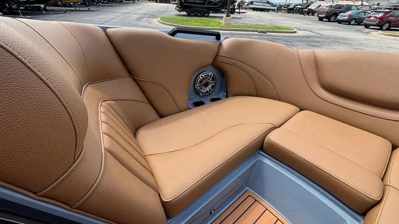 Slide: The Image of Luxurious tan leather seating in 2025 MB B52 23 Alpha boat, featuring built-in speaker. - 16
